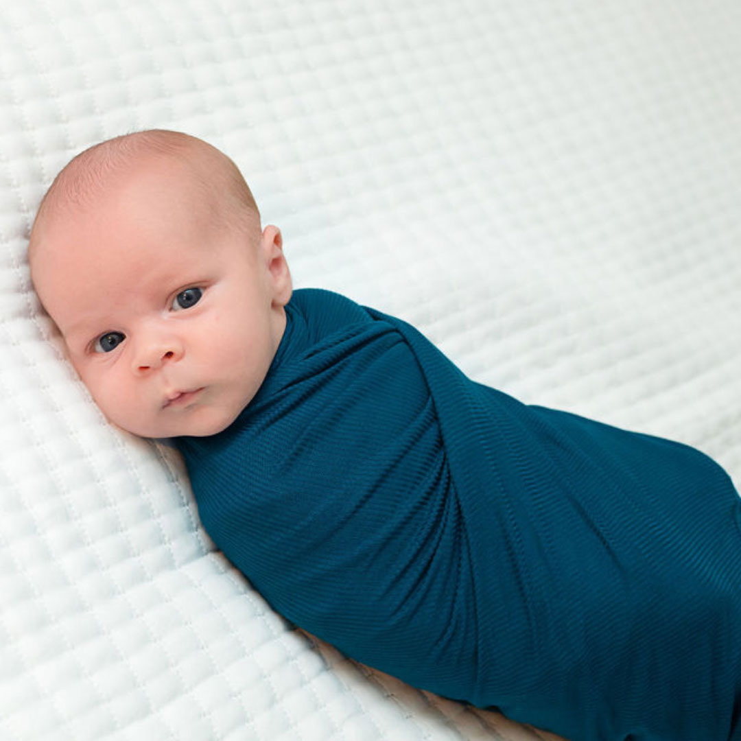 ribbed knit swaddle blanket, jewel blue knit swaddle, ribbed receiving gown, dark blue stretchy swaddle